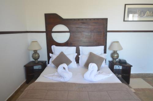 Ένα ή περισσότερα κρεβάτια σε δωμάτιο στο Hôtel Océan Vagabond