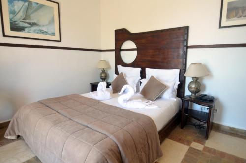 Ένα ή περισσότερα κρεβάτια σε δωμάτιο στο Hôtel Océan Vagabond