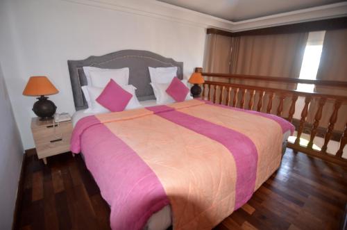 Ένα ή περισσότερα κρεβάτια σε δωμάτιο στο Hôtel Océan Vagabond