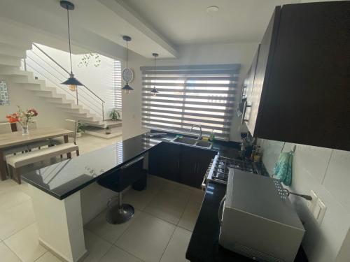 a kitchen with a sink and a counter top at Casa en Riviera Veracruzana in Guadalupe