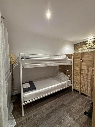 a bedroom with two bunk beds in a room at Olive Stonehouse in Plomarion