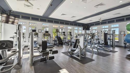a gym with treadmills and elliptical machines at Landing at Marisol at Viera - Melbourne in Viera