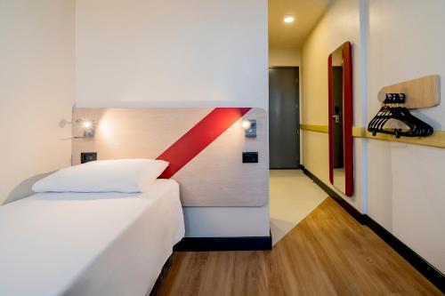 Un ou plusieurs lits dans un hébergement de l'établissement ibis budget Sao Paulo Paulista