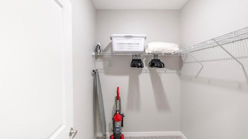 a kitchen with a shelf with tools on it at Landing Apartments Dry Creek - Huntsville in Huntsville