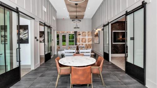 a dining room with a table and chairs at Landing Apartments Dry Creek - Huntsville in Huntsville