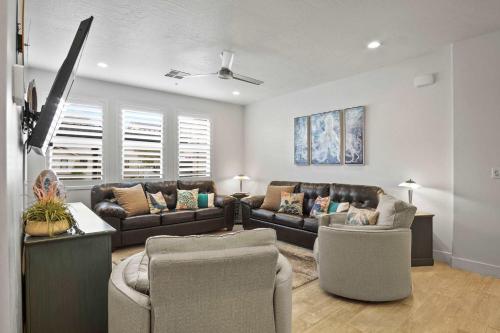 a living room with couches and chairs in a room at By the Sea - Ocean Vibes in the Desert in Washington