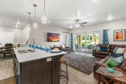 a kitchen and living room with a living room at Walking on Sunshine - Ground Level in St. George