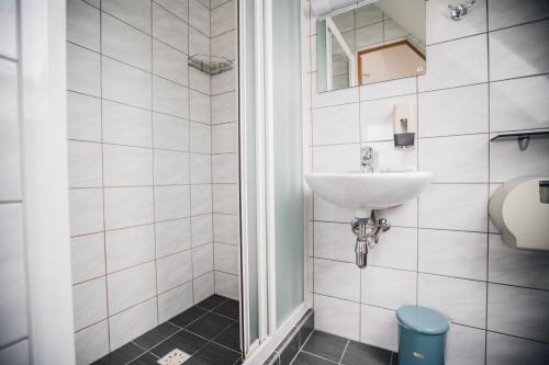 a bathroom with a sink and a toilet at Villa River Rose in Jõesuu