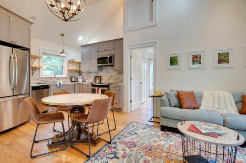 a kitchen and living room with a table and a couch at Getaway with Guest House - 6 Mi to Lake Glenville! in Glenville