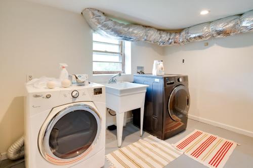 a laundry room with a washing machine and a sink at Getaway with Guest House - 6 Mi to Lake Glenville! in Glenville
