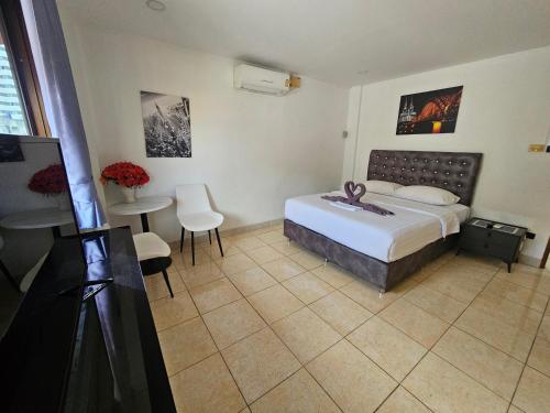 Postel nebo postele na pokoji v ubytování Candy Beach Seaview Jomtien