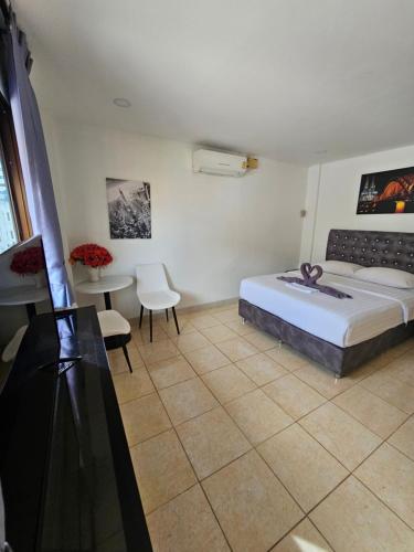 Postel nebo postele na pokoji v ubytování Candy Beach Seaview Jomtien