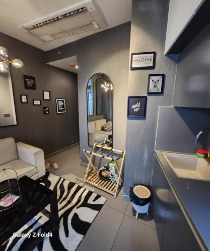 a living room with a zebra rug and a sink at Euphoria 42nd floor by Rouge stays in New Delhi