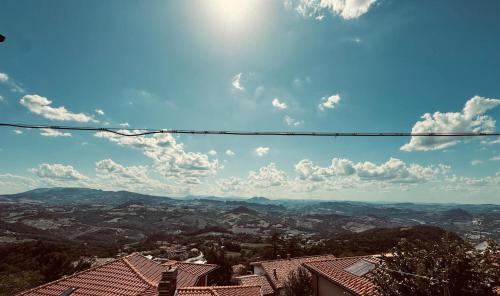 a view of a city with the sky and clouds at Independent House a due passi dal Centro Storico in San Marino