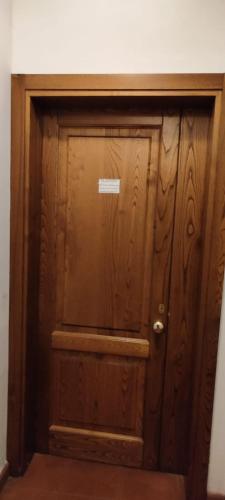 a wooden door with a sign on it at da Antonio in Foligno