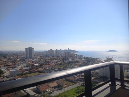 a view of the city from the balcony at Horizonte Infinito - Skyline Comfort Club - Penha in Penha