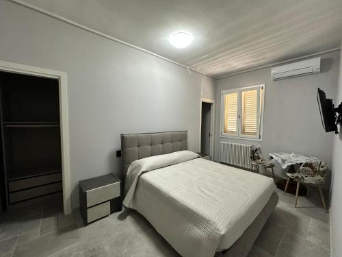 Postel nebo postele na pokoji v ubytování Casa in mezzo agli Ulivi