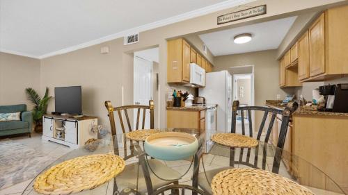 a kitchen and dining room with a table and chairs at Coastal Clipper - Charming 2 BDR Walk to Beach in St. Augustine