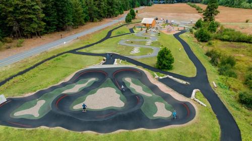 an aerial view of a golf course on a road at Suncadia 3 Bdrm Home w/Bonus room + Game room in Cle Elum