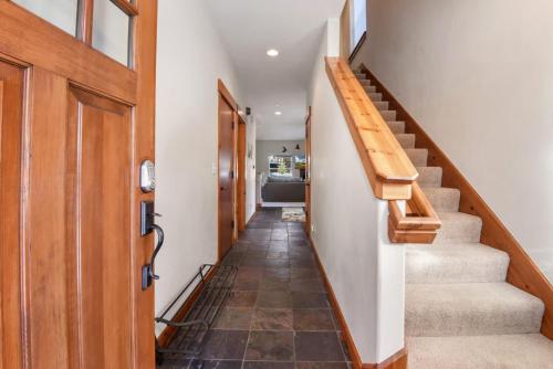 a hallway with stairs leading to a kitchen at Sunny Woods Acres - Near Golf & Adventure Park in Tahoe Vista