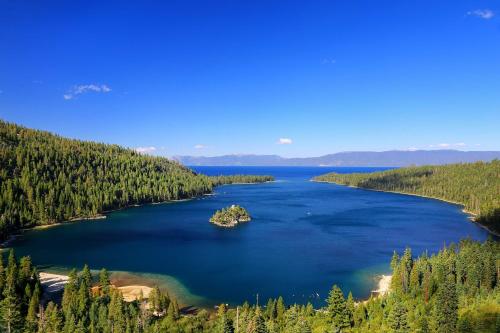an island in a lake in the middle of a forest at Vista Point - 5 Minutes to Kings Beach in Tahoe Vista