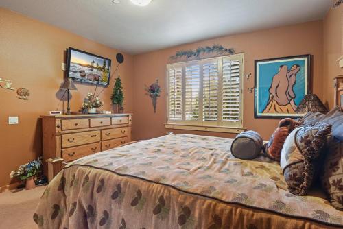 a bedroom with a bed with a dresser and a window at Crystal Charm Amazing 3 BDR Condo Close to Beaches Casinos & Skiing in Crystal Bay