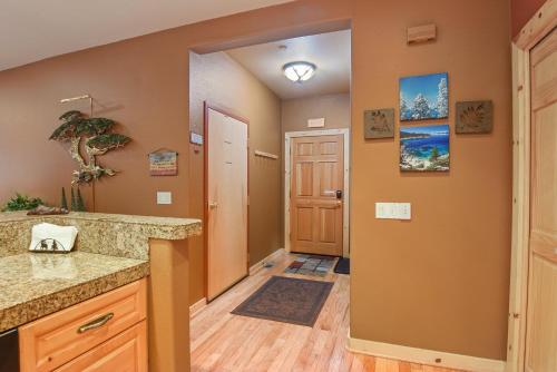 a kitchen with a counter and a hallway with a door at Crystal Charm Amazing 3 BDR Condo Close to Beaches Casinos & Skiing in Crystal Bay