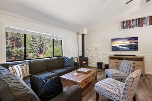 a living room with a couch and a table at Incline Bliss Dreamy Pet Friendly Escape in Incline Village