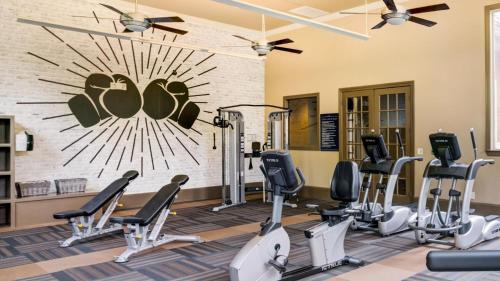 a fitness room with treadmills and cardio equipment at Landing at Residences at River Park West - Richmond in Richmond