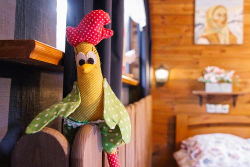 a wooden chicken decoration on a wooden fence at Willa pod Jemiołą in Wisła