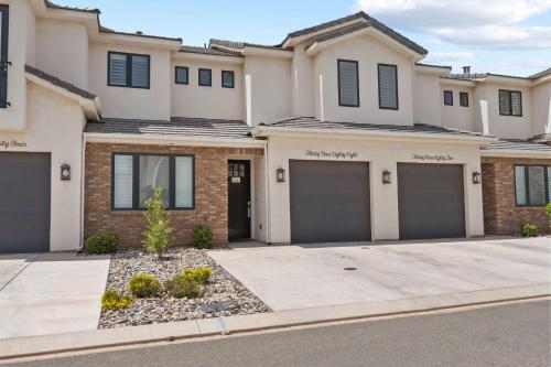 a house with four garage doors in a driveway at Live in Fantasy at Disney in the Desert in Washington