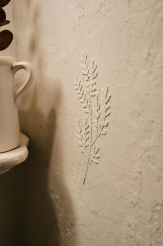 a drawing of a plant on a wall at Penzion Na Červeném Potoce in Králíky
