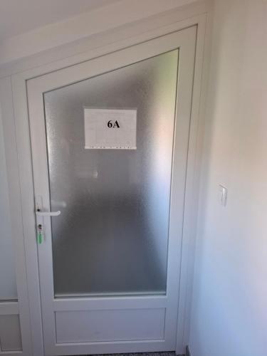 a glass door with a sign on it at MIRKO DIVING CENTER in Rab