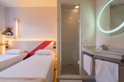 Un ou plusieurs lits dans un hébergement de l'établissement ibis budget Sao Paulo Paulista