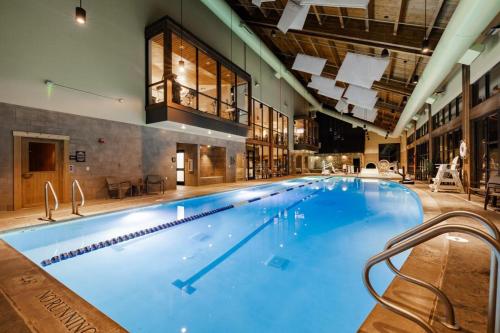 a large swimming pool in a large building at Suncadia 5 Bed Refined Alpine Home in Cle Elum