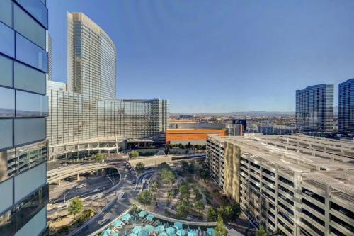 an aerial view of a city with tall buildings at Luxurious Vdara High Rise Room, City Skyline Views, King Bed, Free Valet in Las Vegas