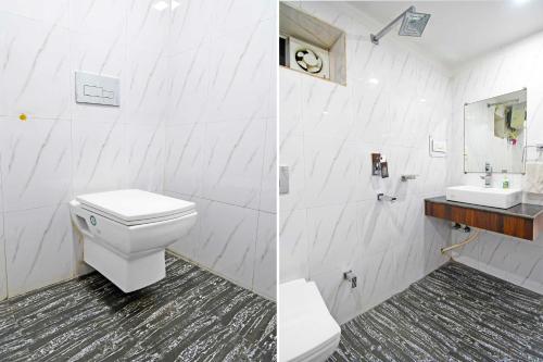 a white bathroom with a toilet and a sink at Collection O Sahayogi Near Big Bazaar in Dhanbād