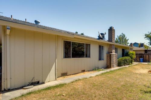 a house with a dog on the roof of it at Updated Home in Suburbs - 10 Mi to Dtwn Stockton! in Stockton
