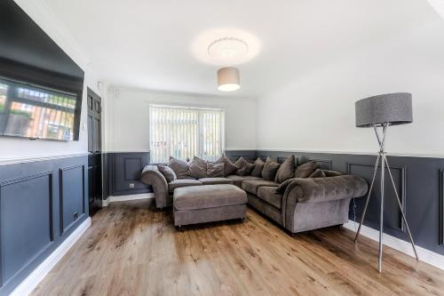 a living room with a couch and a chair at Modern 3 bed House in Upton