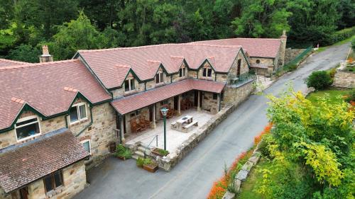an overhead view of a large house with a street at Nant Ucha Farm in Acrefair