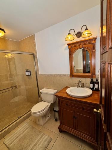 a bathroom with a toilet and a sink and a shower at Hacienda San Angel in Ensenada