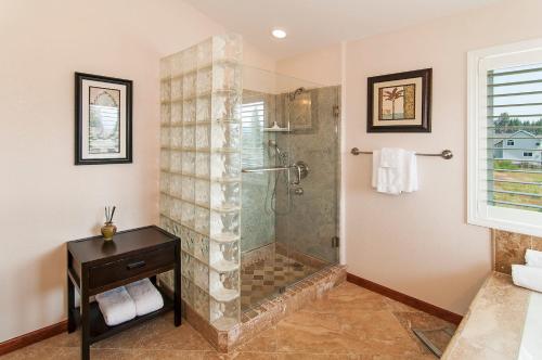 a bathroom with a shower with a glass door at Mule Meadows - Classy Split level South Tahoe home in South Lake Tahoe