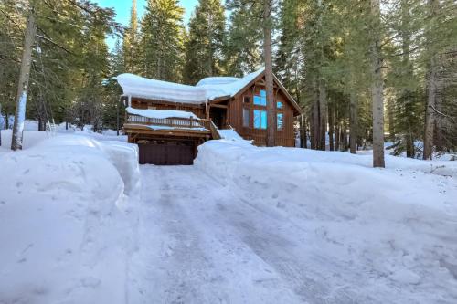 a log cabin in the woods in the snow at Shining Shire - Sauna steam shower very cool in South Lake Tahoe