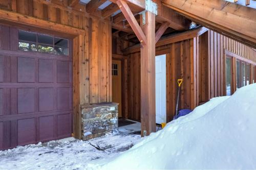 a house with a garage in the snow at Shining Shire - Sauna steam shower very cool in South Lake Tahoe