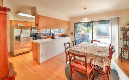 a kitchen with a table and chairs and a kitchen with a table and a table at Tahoe Family Getaway in Stateline