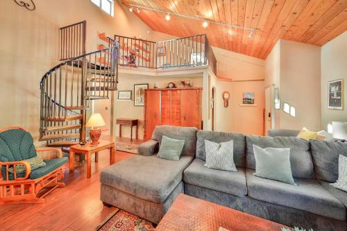a living room with a couch and a staircase at Tahoe Family Getaway in Stateline