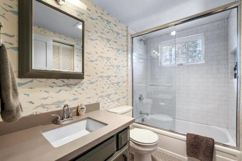 a bathroom with a sink and a toilet and a shower at Christmas Valley Chalet - Tahoe Adventure Awaits in South Lake Tahoe