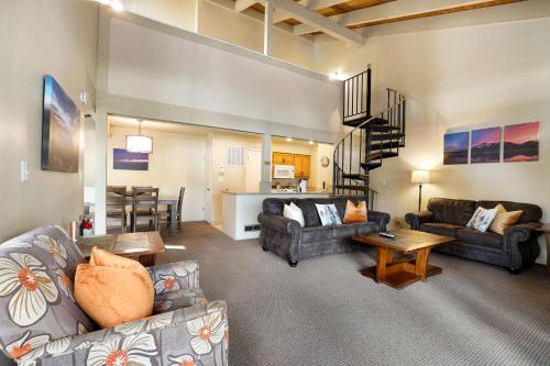 a living room with two couches and a dining room at Lakeland Sandy Beach Retreat - Private Escape in South Lake Tahoe