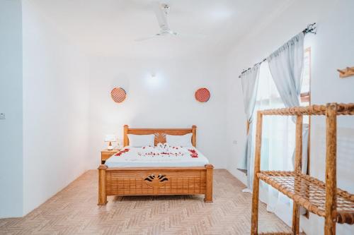 Un pat sau paturi într-o cameră la Bella Vista Resort Zanzibar