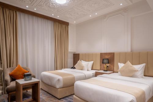 Postel nebo postele na pokoji v ubytování Nars Plus Al Naeem Hotel